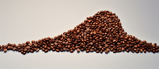Naklejka premium Studio shot of coffee beans shaped as an arrow. copy space available