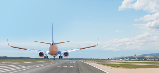 Passenger airplane landing to airport -  Tire tracks of airplane tires left marks on the runway  © muratart