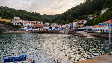 Wide landscape of a beautiful fishing village. It is the village of Tazones, in Asturias - Spain