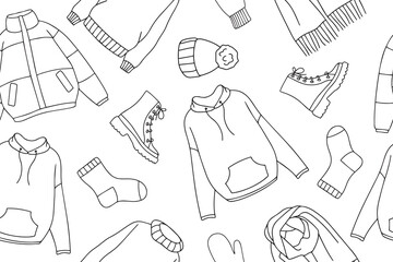 Warm autumn and winter clothes seamless pattern in doodle style. Vector collection of warm, cozy clothes and shoes. Seasonal clothing seamless pattern. Vector illustration