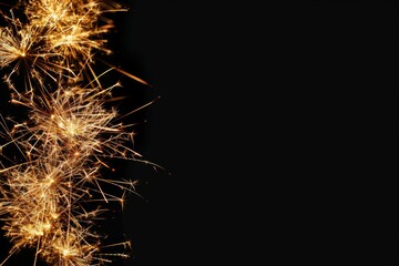 Golden firework displayed on black, a festive concept for the new year
