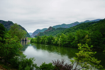 Fototapeta premium Olt river in a cloudy day, Transylvania, Romania