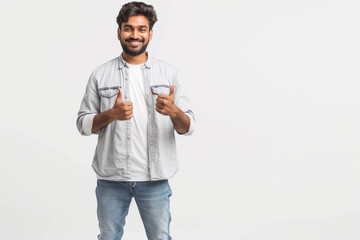 Indian man smile, age 30, white background, black hair, white grey shirt blue jean, white shoes, full body, daylight, isolated, one hand giving a thumbs up,