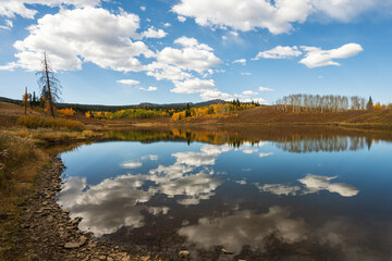 Steamboat Springs Colorado fall colors with cloud reflection in Dumont Lake