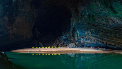 View of the camp site across the lake in Hang En Cave, the first cave and camp site of Son Doong...