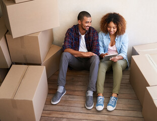 New home, boxes and couple with tablet, relax and property with digital app, real estate and...