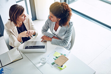 Laptop, paperwork and business people in office together for research ideas, teamwork or...