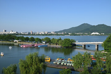 Fototapeta premium view of embankment on the lake in sunny afternoon in Nanjing
