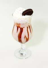  A delicious milkshake with chocolate sauce and cookies