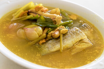 Turmeric fish soup (Pla Tom Kamin). A perfectly cooked fish fillet, simmered in a flavorful broth with a variety of vegetables and spices.