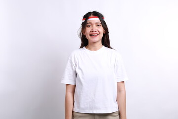 Happy young Asian woman is smiling, isolated on white background. Indonesian independence day concept