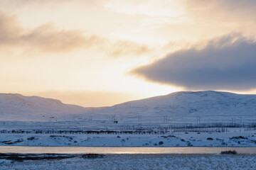 Winter sunset over snowy plains