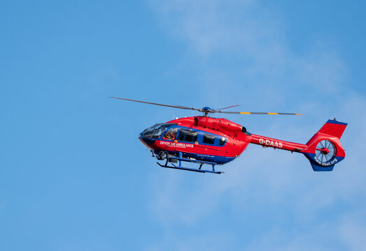 Exmouth, devon, England, February 2nd 2022. Devon air ambulance flies across perfect blue skies at Exmouth, Devon.