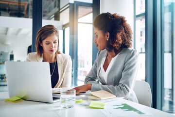 Laptop, discussion and women in office together for research, teamwork and partnership. Strategy,...