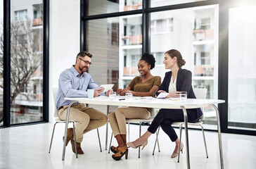 Businesspeople, tablet and meeting for collaboration, feedback or brainstorming as coworkers. Team,...