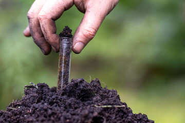 farmer holding soil looking at soil carbon in the america