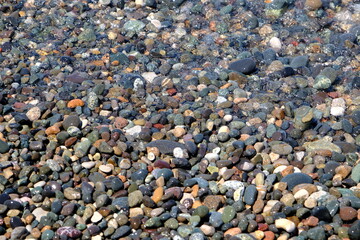 pebbles on the beach. Pebble beach background.