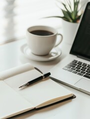 A high-angle shot of an office desk with a laptop, notebook, pen, and a cup of coffee, leaving plenty of blank space around the items for adding text.