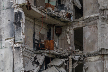 Destroyed and abandoned residental building during war in Ukraine.