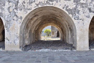 Fototapeta premium The archway is empty and the stone is weathered. The archway is a part of a San Juan Ulua Museum and it is empty