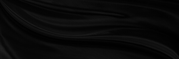 Black gray satin dark fabric texture luxurious shiny that is abstract silk cloth panorama background with patterns soft waves blur beautiful.
