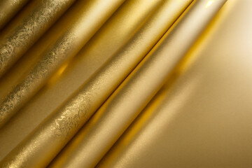 Golden silk curtain background with smooth, luxurious texture