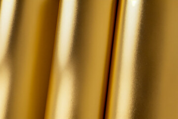 Silk golden curtain with soft, smooth texture and elegant flowing design
