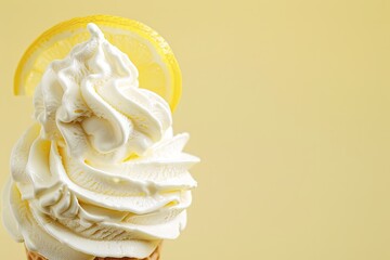 Lemon ice cream cone with a lemon slice garnish on a yellow background