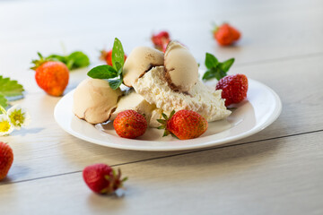 fresh organic cottage cheese with strawberries and ice cream in a plate on a wooden table