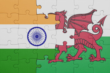 puzzle with the colourful national flag of wales and flag of india.