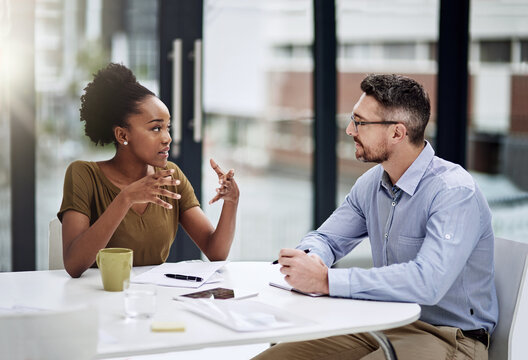 Businesspeople, discussion and meeting for collaboration, feedback or brainstorming as coworkers. Team, talking and planning for company, workplace or project in startup with together as professional
