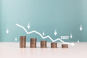 Concept of cost, lean or cost reduction. Coin stack with the word cost and down arrow for...