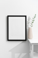 Vertical black picture frame mockup with copy space