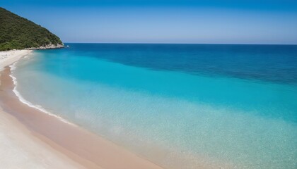 Fototapeta premium Top view of crystal clear water and sand on a tropical beach. Turquoise ocean, perfect summer vacation.