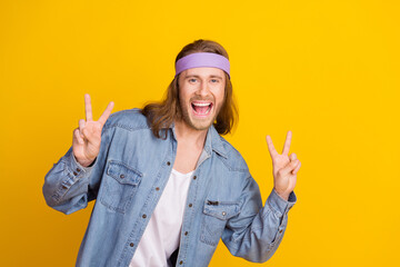 Photo portrait of attractive young hippie man show double v-sign wear trendy denim outfit isolated...