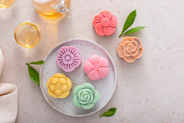 Traditional Chinese snow skin mooncakes for mid autumn festival with fruit, taro and matcha filling