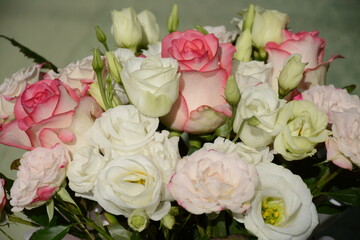 Pink rose flowers and white eustoma flowers in a festive bouquet