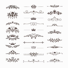 A collection of ornate design elements, primarily in the form of decorative dividers or borders. These designs are symmetrical and feature a mix of floral and crown motifs. They are positioned horizon