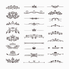 A collection of ornate design elements, primarily in the form of decorative dividers or borders. These designs are symmetrical and feature a mix of floral and crown motifs. They are positioned horizon