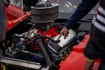 Dragster hotrod engine motor, shiny engine human hands repairing car vehicle 