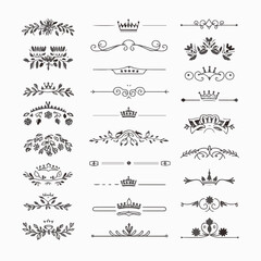 A collection of ornate design elements, primarily in the form of decorative dividers or borders. These designs are symmetrical and feature a mix of floral and crown motifs. They are positioned horizon