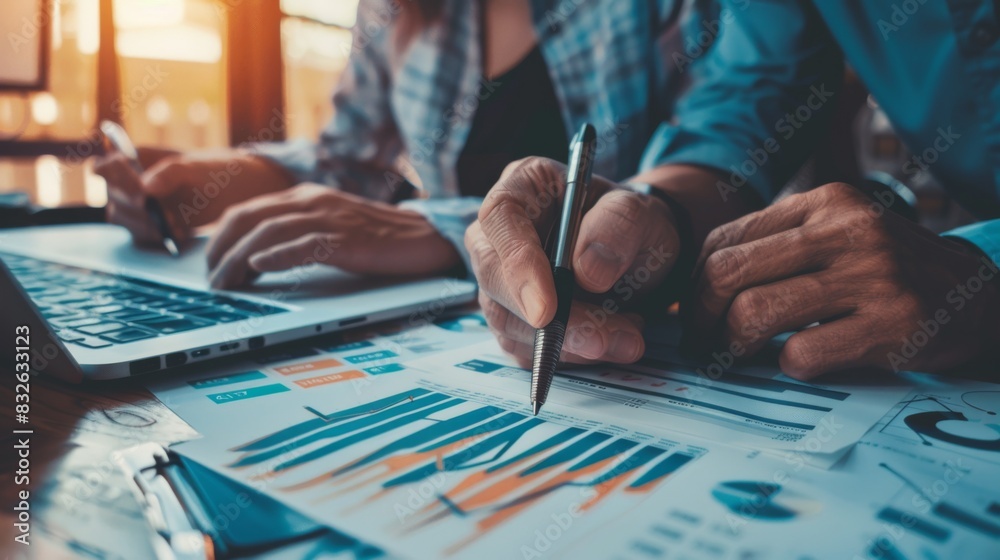 Poster a financial planner reviewing stock market performance with a client while pointing to a stock marke