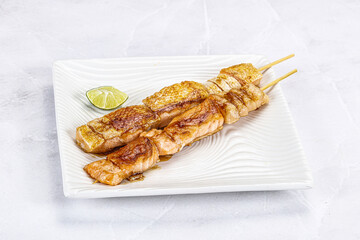 Grilled salmon skewer with sauce