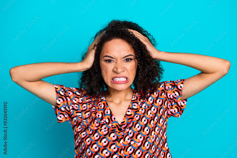 Wall mural Photo of furious angry lady dressed print shirt arms head showing teeth isolated teal color background