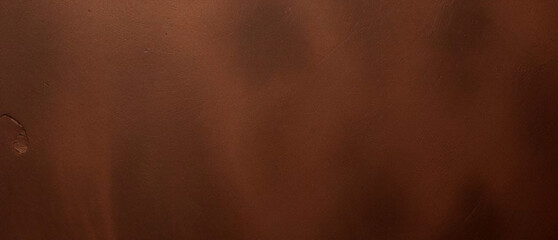Fototapeta premium Close-up texture of reddish-brown surface with rugged and cracked patterns