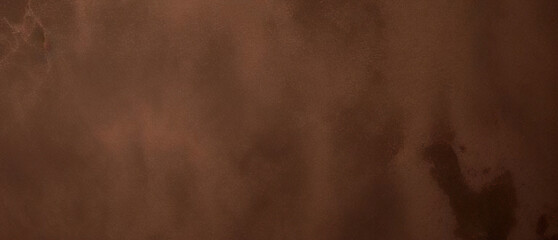 Close-up texture of reddish-brown surface with rugged and cracked patterns