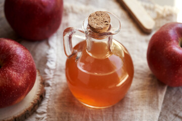 A bottle or jug of apple cider vinegar