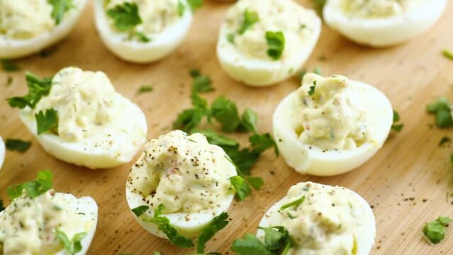 stuffed eggs, deviled eggs on a wooden table