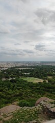 aerial view of a large city that combines urban and green spaces.