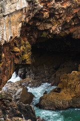 Boca do Inferno (Hell's Mouth) is a unique rock formation on the edge of the ocean in Cascais, Portugal. Cloudy day.